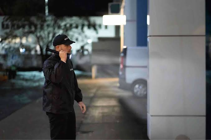 A Saz Security officer on duty at night, representative of the vigilance our personnel provide